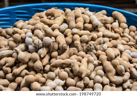 Tamarind taken as background. A sweet and sour fruit grown in Thailand. Nature\'s Laxative.