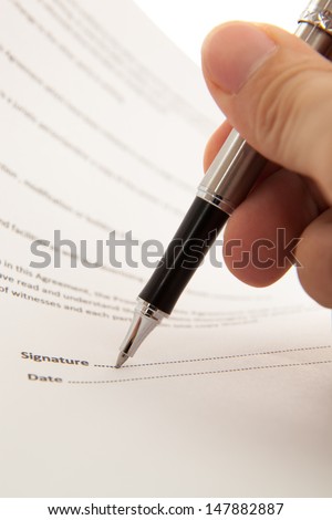 Man hand signing a contract