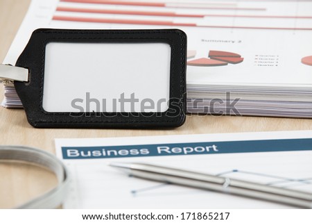 Business graph analysis report with name tag. Accounting