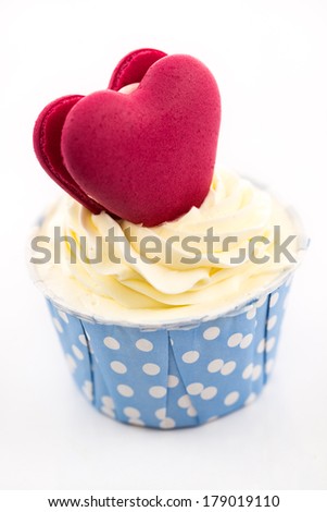 Tasty cupcake with butter cream on white background