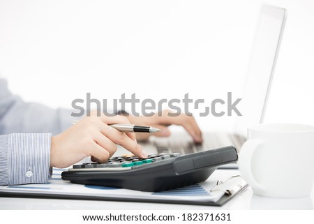 Business woman analyzing investment charts with laptop. Accounting