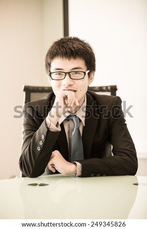 Image of young handsome confident businessman in suit.Asian
