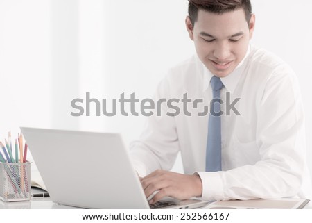 young asian businessman working in office
