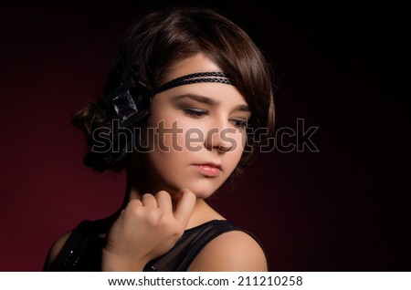 Beautiful young woman portrait. Model looking down.