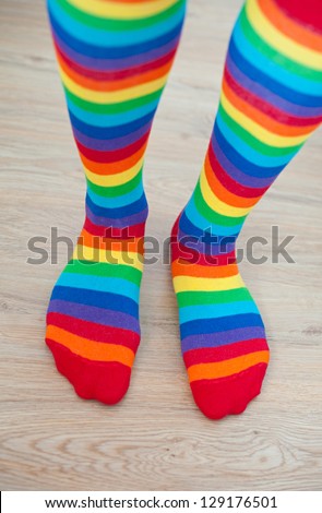 Legs in striped socks stockings.