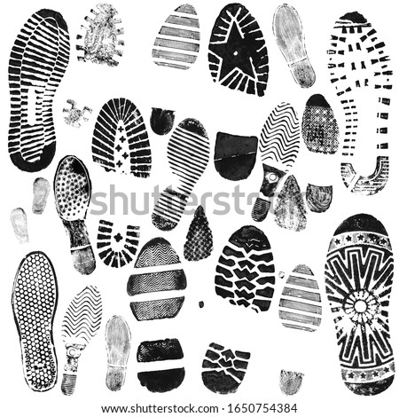 Shoe prints in black on a white background. Сток-фото © 