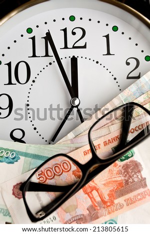 Large clock with money and glasses