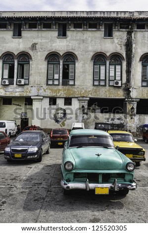 Havana, Cuba. Street scene with old car and worn out buildings.
