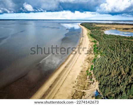 Similar – Image, Stock Photo The Wadden Sea World Heritage Site with asphalted dike on the coast of the North Sea in Norddeich near Norden in East Frisia in Lower Saxony