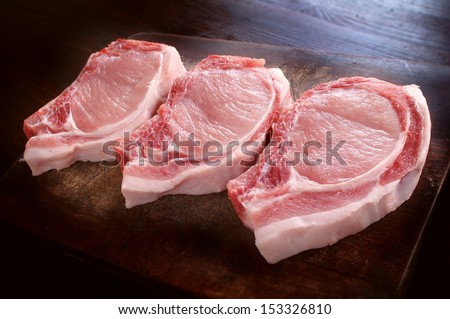 uncooked pork chops on