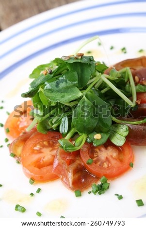 plated tomato and watercress salad