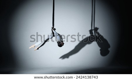 Similar – Image, Stock Photo Flexible acrobatic girl sitting on bed