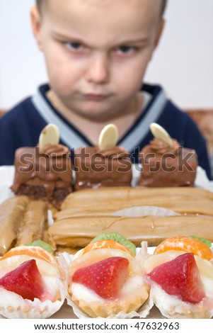boy forbidden to eat cakes