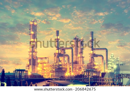 Distillation tank of oil refinery plant, twilight time.