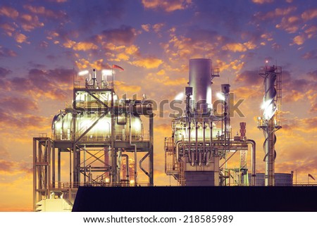 Deaerator or boiler machine in power plant with sky background.