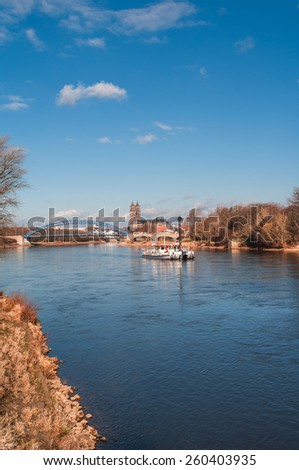View on Magdeburg Cathedral, New Bridge and an old ferry on river Elbe, Magdeburg, Germany, spring 2014