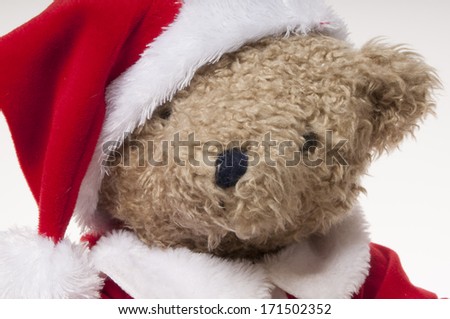 teddy bear dressed as Santa isolated on white background