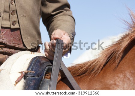 Cowboy on horseback. Horse ride. Equestrian sport. Sports riding.