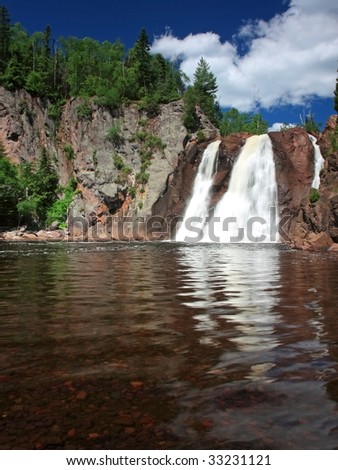 Tettegouche waterfall on the north shore of Lake Superior with water
