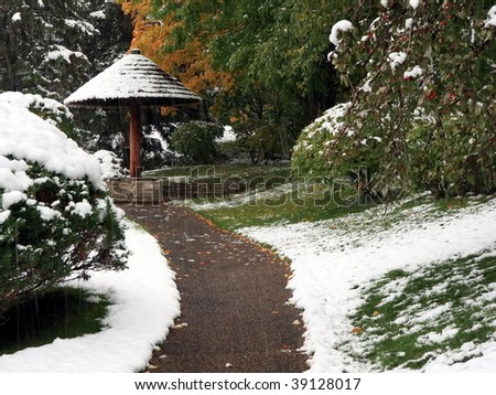 Sidewalk in Japanese garden near Normandale college in Minnesota during snowfall