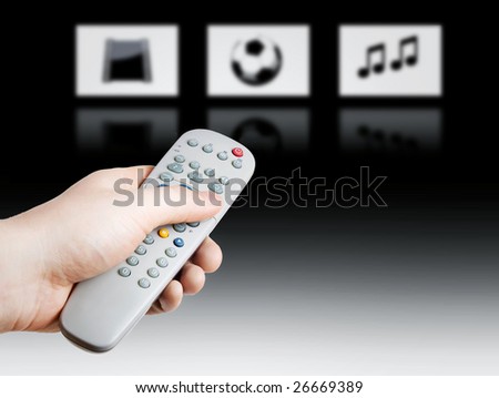 Hand holding a TV remote control on gradient background