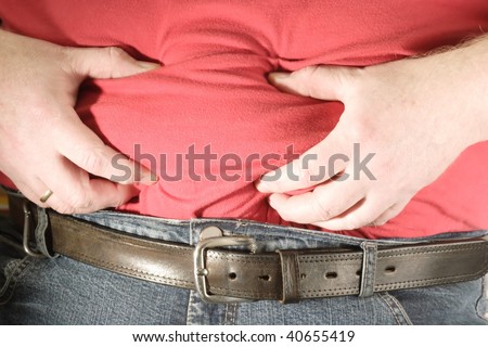Overweight man with his hands on his waist.
