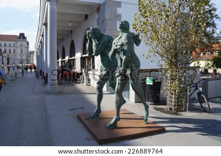 LJUBLJANA, SLOVENIA - OCTOBER 12: Modern sculpture of Adam and Eve, ashamed and banished from Paradise, made by contemporary Slovene sculptor Jakov Brdar. Ljubljana, Slovenia, October 12, 2014