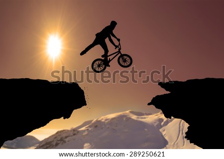 Man on bike jumping silhouette