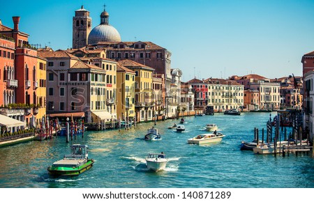 grand channel with boats and color architecture in Venice, Italy
