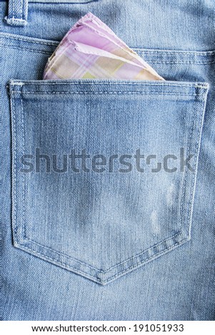 Pink handkerchief in a jeans pocket closeup