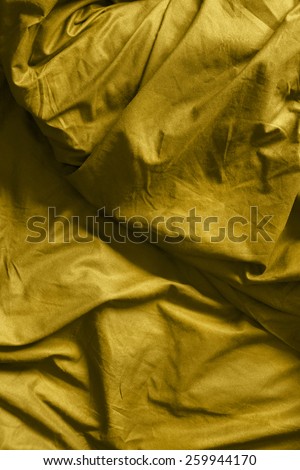 Yellow crumpled blanket as a background
