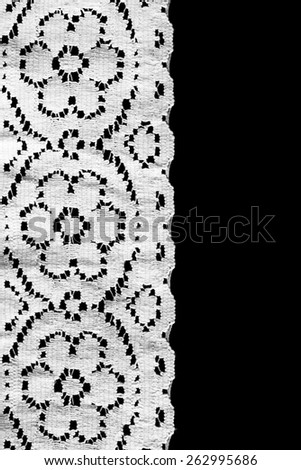 White vintage border lace over black background
