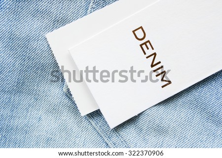 White clothes label on denim background