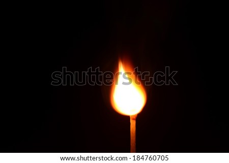match fire isolated on black background