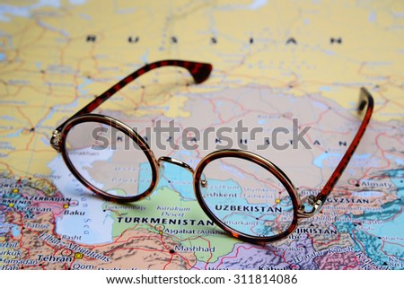Glasses on a map of Asia - Uzbekistan