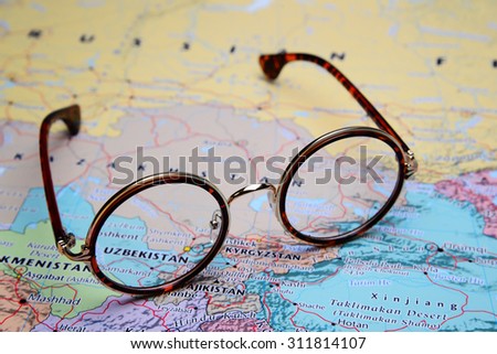 Glasses on a map of Asia - Uzbekistan