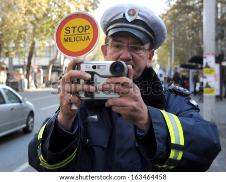 BELGRADE, SERBIA - CIRCA NOVEMBER 2011: Unidentified police officer films traffic violation, circa November 2011 in Belgrade.