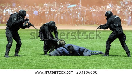 BELGRADE, SERBIA - CIRCA MAY 2015: Serbian special force police practices anti terrorist attack with dog, circa May 2015 in Belgrade