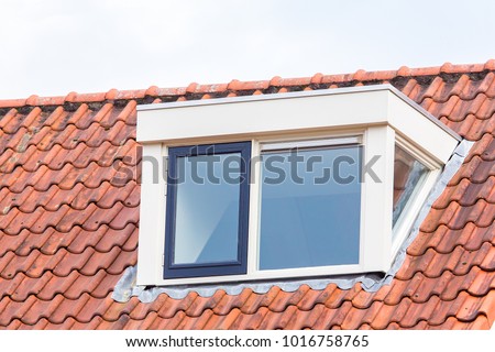 Dormer window on  roof of house with orange roof tiles Stock foto © 