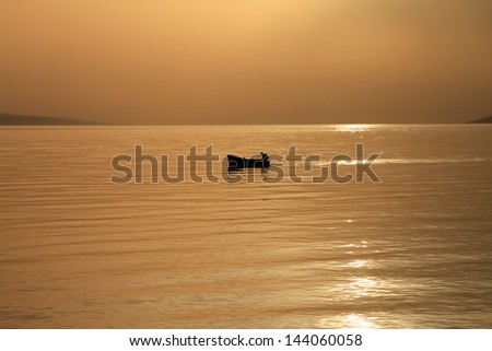 Small boat with beautiful sunset,Croatia moments