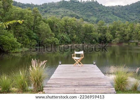 Similar – Wooden planked footway in calm evening lake