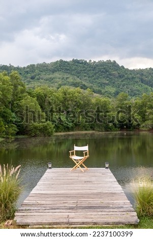 Similar – Wooden planked footway in calm evening lake