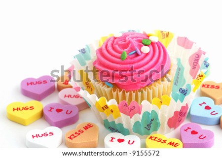 Mini cupcake surrounded by conversation hearts