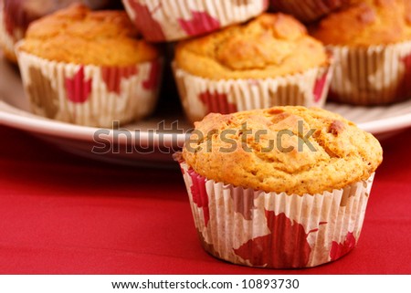 Pumpkin cupcakes with shallow depth of field and focus on the foreground cupcake