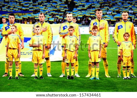 KIEV, UKRAINE - SEP 10: Ukraine national football team during the national anthem during the qualifying match 2014 World Cup, 10 September 2013, NSC Olympic Stadium, Kiev, Ukraine