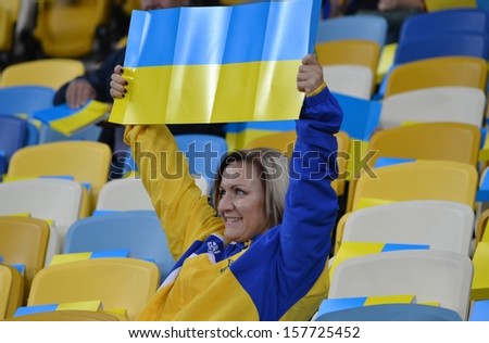 KIEV, UKRAINE - SEP 10: Fans of the Ukrainian national team in the stands before the qualifying match 2014 World Cup between Ukraine vs England, 10 September 2013, NSC Olympic Stadium, Kiev, Ukraine