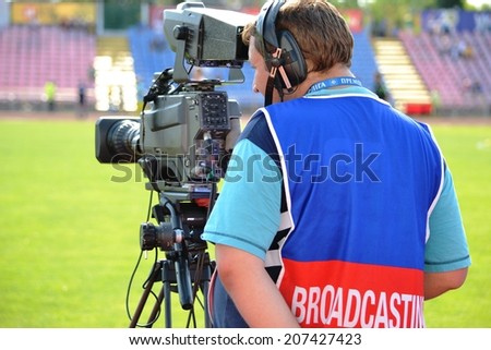 CHERKASSY, UKRAINE - JUNE 8: Videographer with a camera before the qualifying match youth national teams for the European Championships 2015, 8 June 2014, Cherkassy, Ukraine