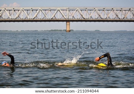 CHERKASSY, UKRAINE - AUG 8: Swimmers rowing and compete in VI International swim across the Dnieper River, 10 km, 8 August 2014, Cherkassy, Ukraine