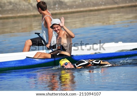 CHERKASSY, UKRAINE - AUG 8: Swimmers rowing during in VI International swim across the Dnieper River, 10 km, 8 August 2014, Cherkassy, Ukraine