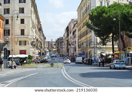 ROME - AUGUST 27, 2014: Road in Rome filled with cars and houses on either side, Rome, Italy